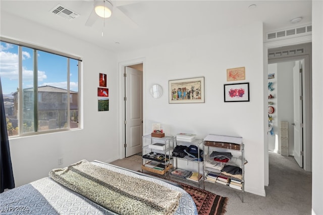 bedroom with ceiling fan and light colored carpet