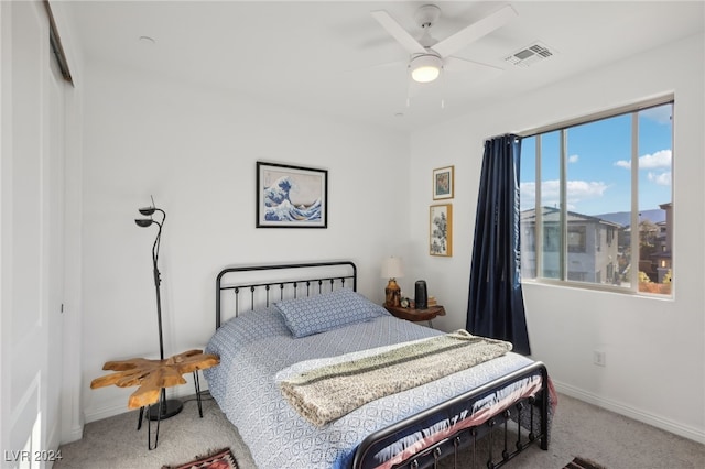 carpeted bedroom with ceiling fan