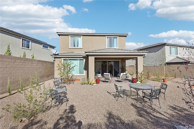 rear view of house with a patio