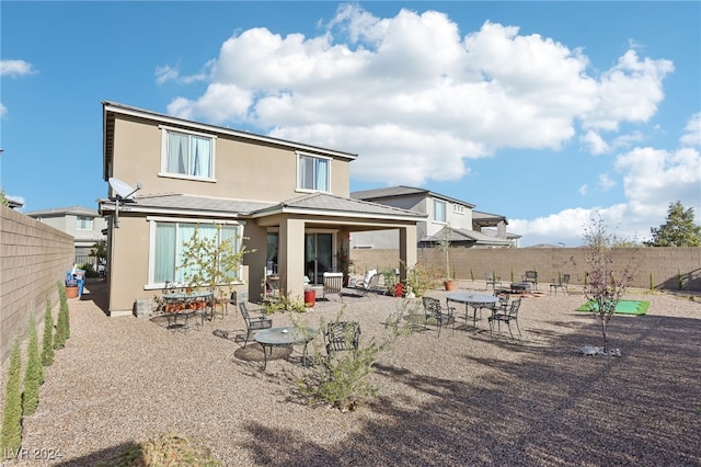 rear view of property with a patio