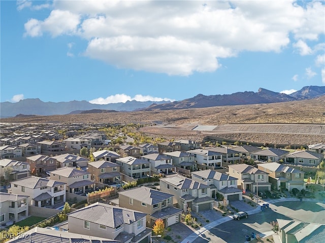 birds eye view of property featuring a mountain view