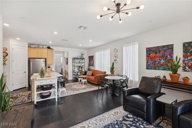 living room with dark hardwood / wood-style floors and a notable chandelier