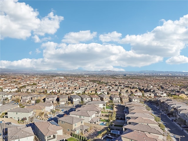 birds eye view of property with a mountain view