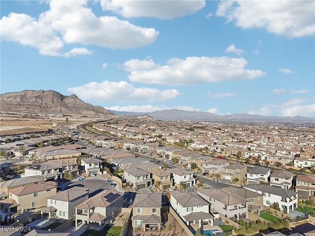 birds eye view of property featuring a mountain view