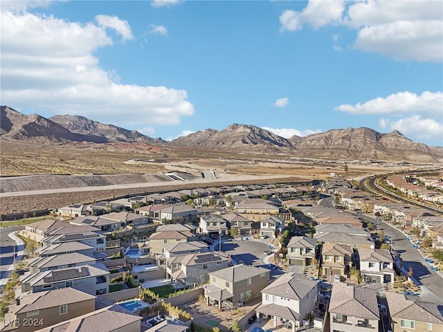 birds eye view of property featuring a mountain view