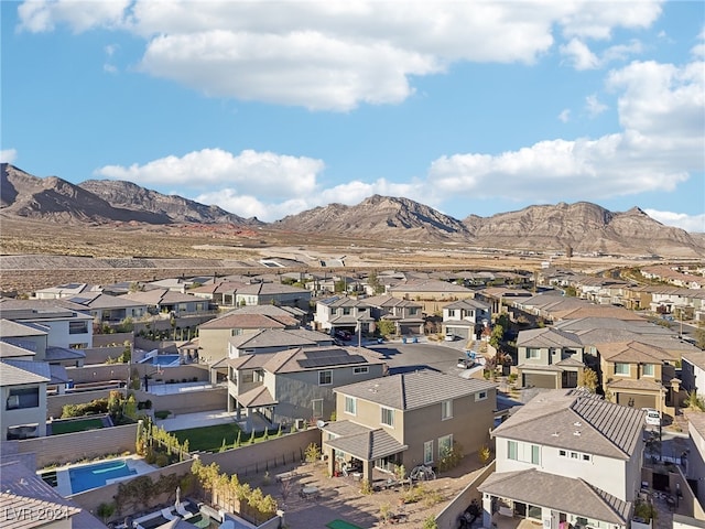 birds eye view of property featuring a mountain view