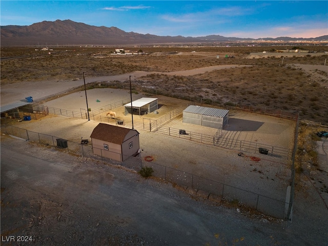 aerial view with a rural view, a mountain view, and view of desert