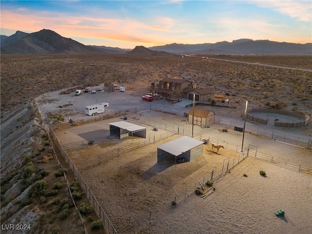 exterior space featuring view of desert, a rural view, and a mountain view