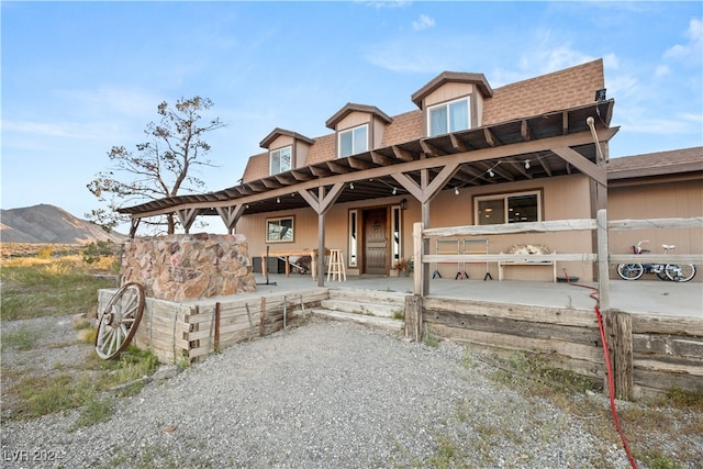 view of front of house with a mountain view