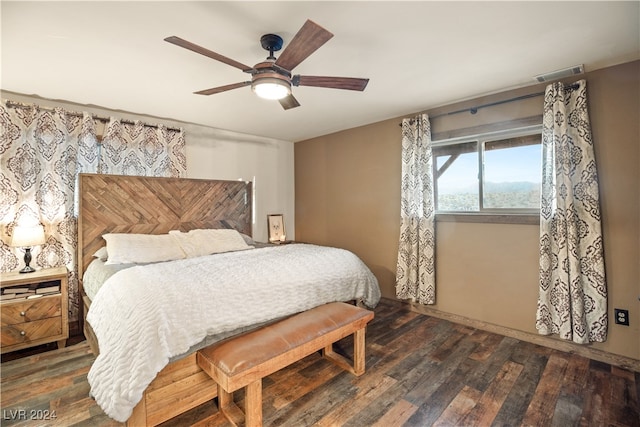 bedroom with visible vents, a ceiling fan, and hardwood / wood-style flooring