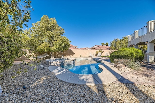 view of pool featuring a patio