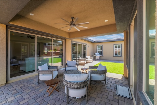 view of patio / terrace featuring a grill, ceiling fan, and an outdoor hangout area