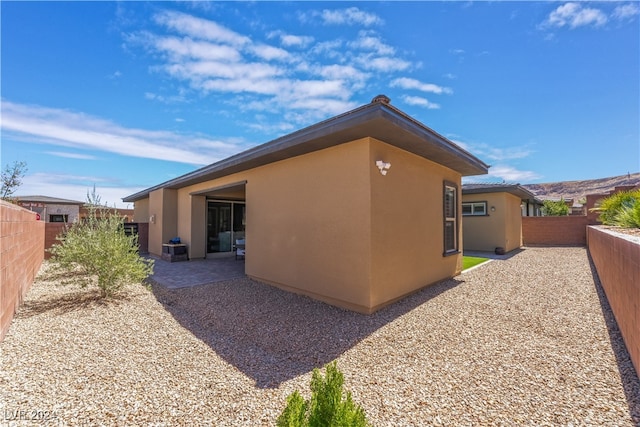 view of home's exterior featuring a patio area