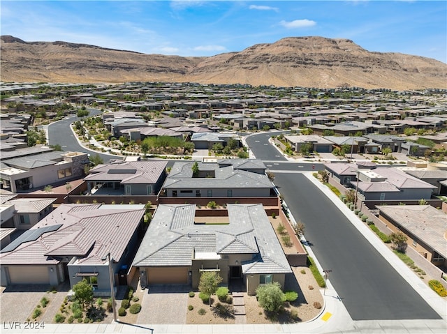 drone / aerial view featuring a mountain view