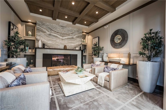 living room with a fireplace, beam ceiling, coffered ceiling, and wood ceiling