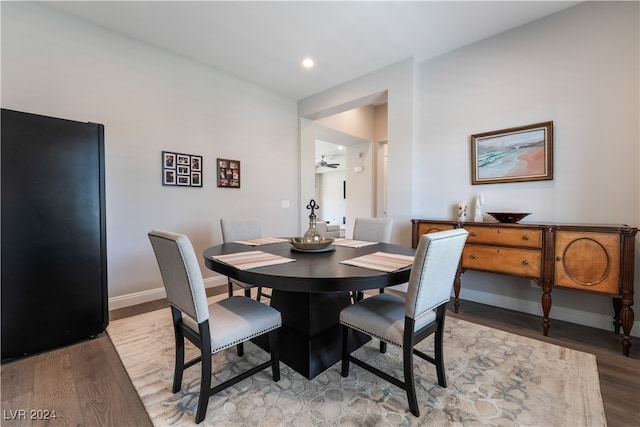 dining space featuring ceiling fan and light wood-type flooring