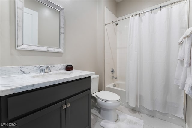 full bathroom with vanity, shower / bath combo, and toilet