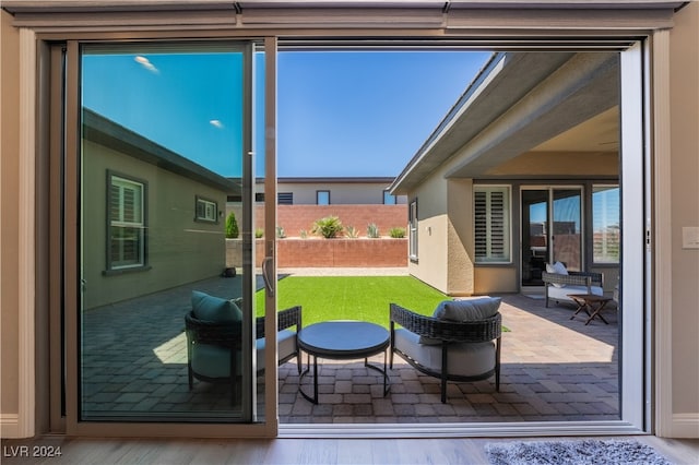 doorway with hardwood / wood-style flooring