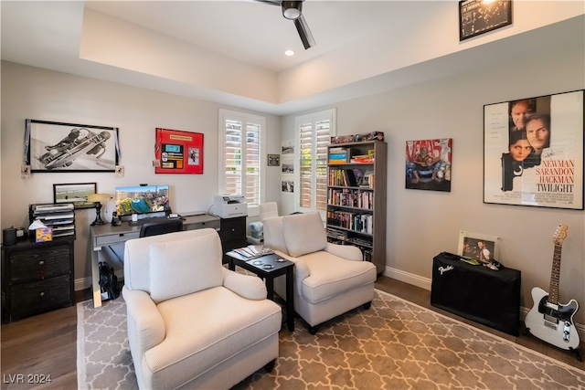 living area featuring ceiling fan and wood-type flooring