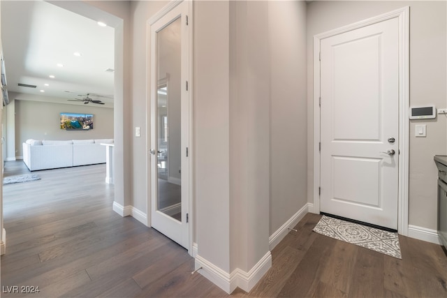 hallway with dark wood-type flooring