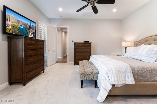 bedroom featuring light carpet and ceiling fan