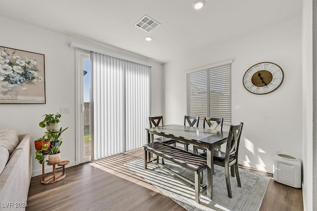 dining space with dark hardwood / wood-style floors