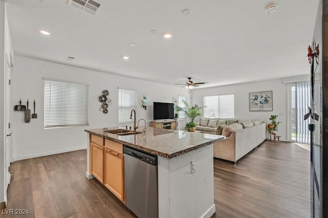 kitchen featuring a center island with sink, dishwasher, dark hardwood / wood-style floors, and sink