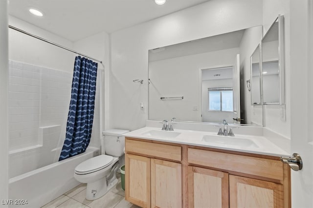 full bathroom featuring tile patterned floors, vanity, toilet, and shower / bathtub combination with curtain