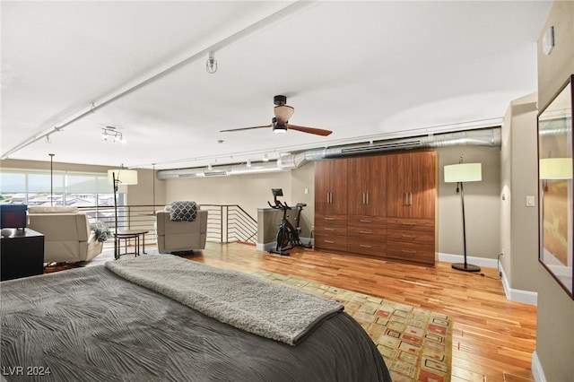 bedroom with hardwood / wood-style flooring and ceiling fan