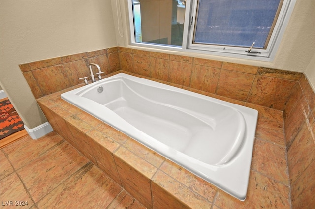 bathroom featuring tiled bath