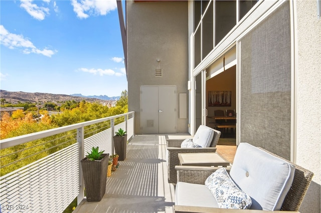 balcony featuring a mountain view