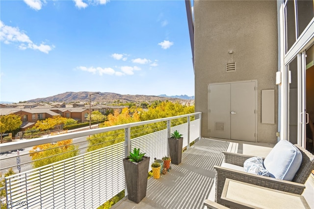 balcony featuring a mountain view