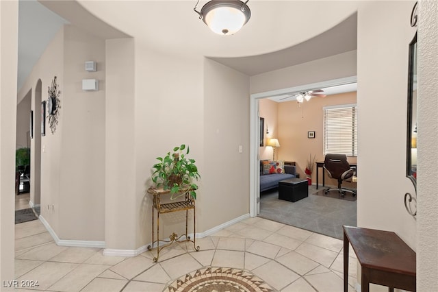 hallway with light tile patterned floors