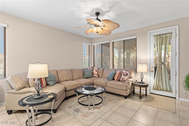 tiled living room with ceiling fan