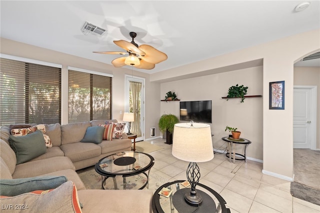 tiled living room featuring ceiling fan