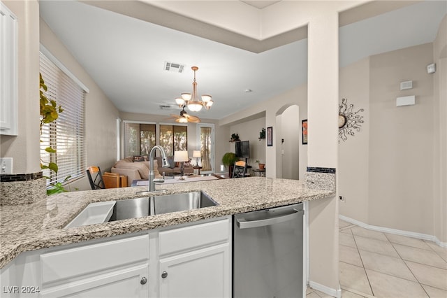 kitchen featuring dishwasher, light stone countertops, sink, and white cabinets