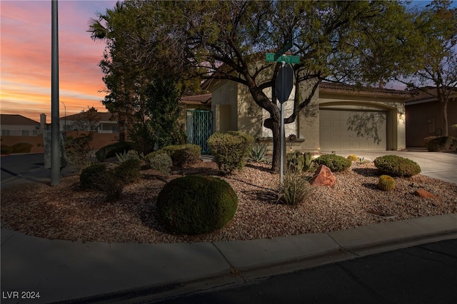 view of front of property with a garage