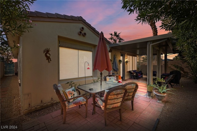 view of patio terrace at dusk