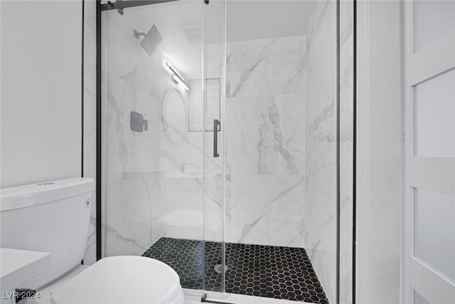 bathroom with toilet and walk in shower