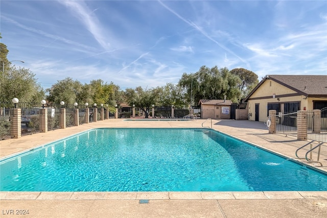 view of swimming pool with a patio