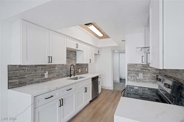 kitchen featuring range with electric cooktop, sink, light hardwood / wood-style flooring, dishwasher, and white cabinetry