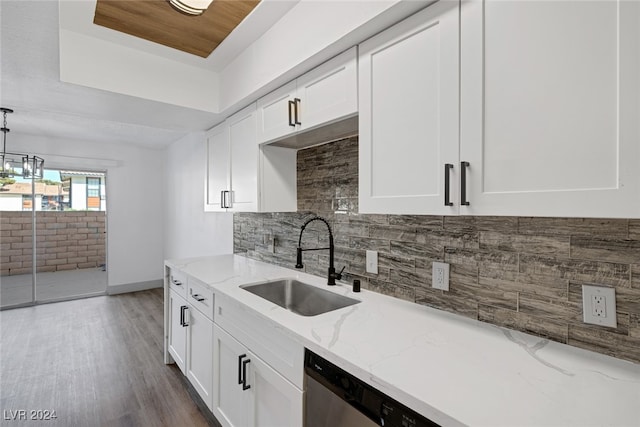 kitchen with white cabinetry, light stone countertops, dark hardwood / wood-style flooring, and sink