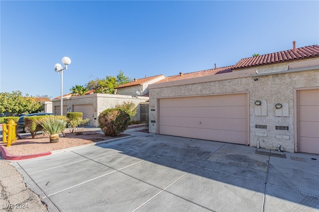 exterior space with a garage