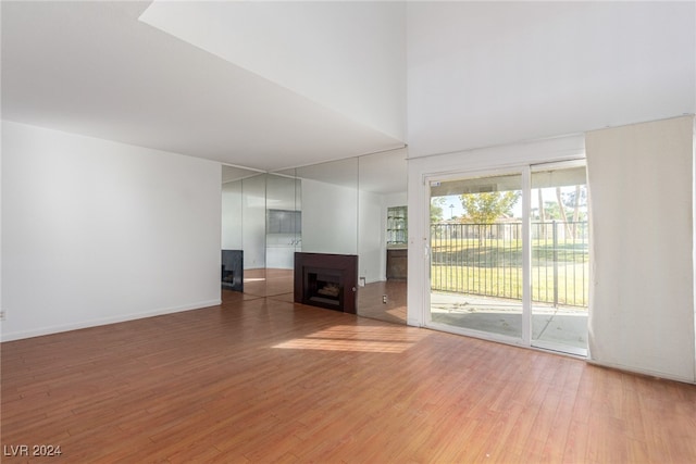 unfurnished living room with wood-type flooring