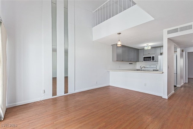 unfurnished living room featuring hardwood / wood-style floors