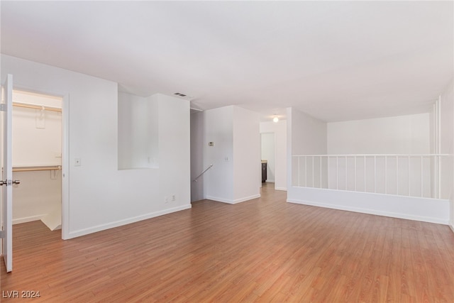 spare room featuring light wood-type flooring