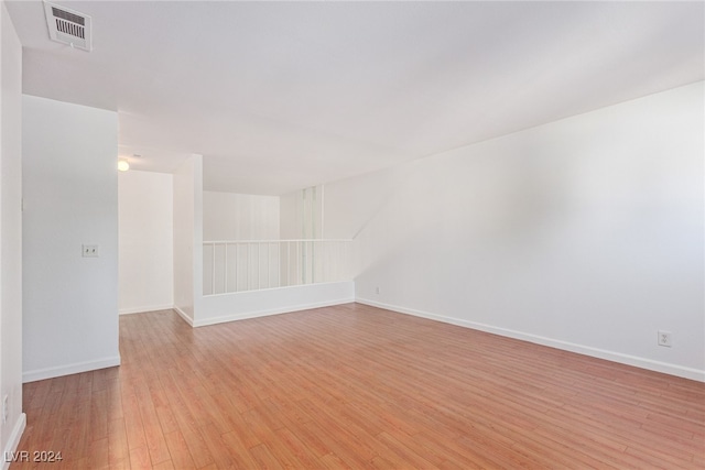 spare room featuring light wood-type flooring