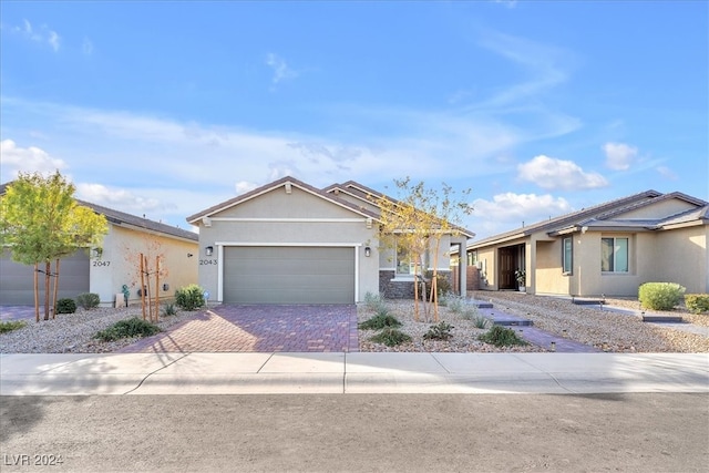 single story home with a garage