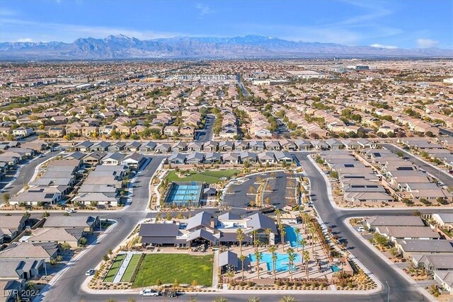 birds eye view of property with a mountain view