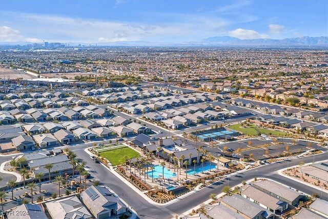 birds eye view of property with a mountain view